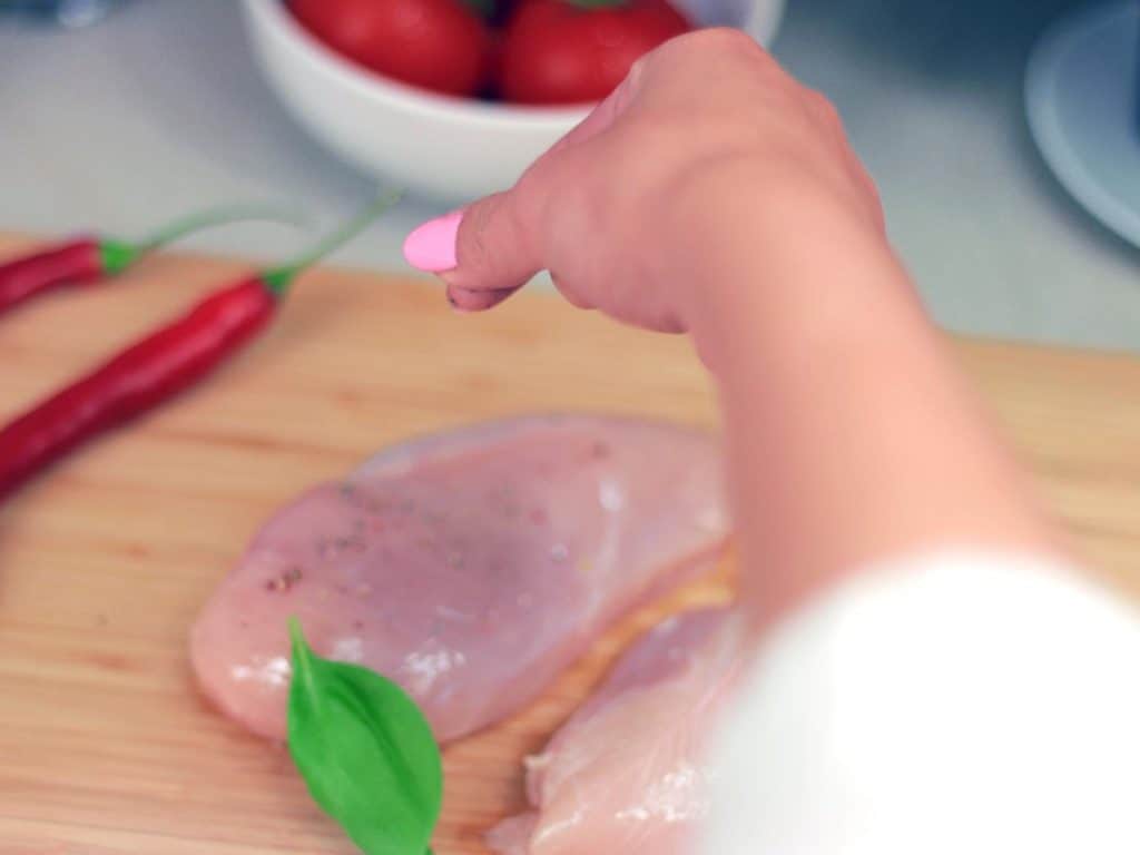 Cutting board and raw chicken